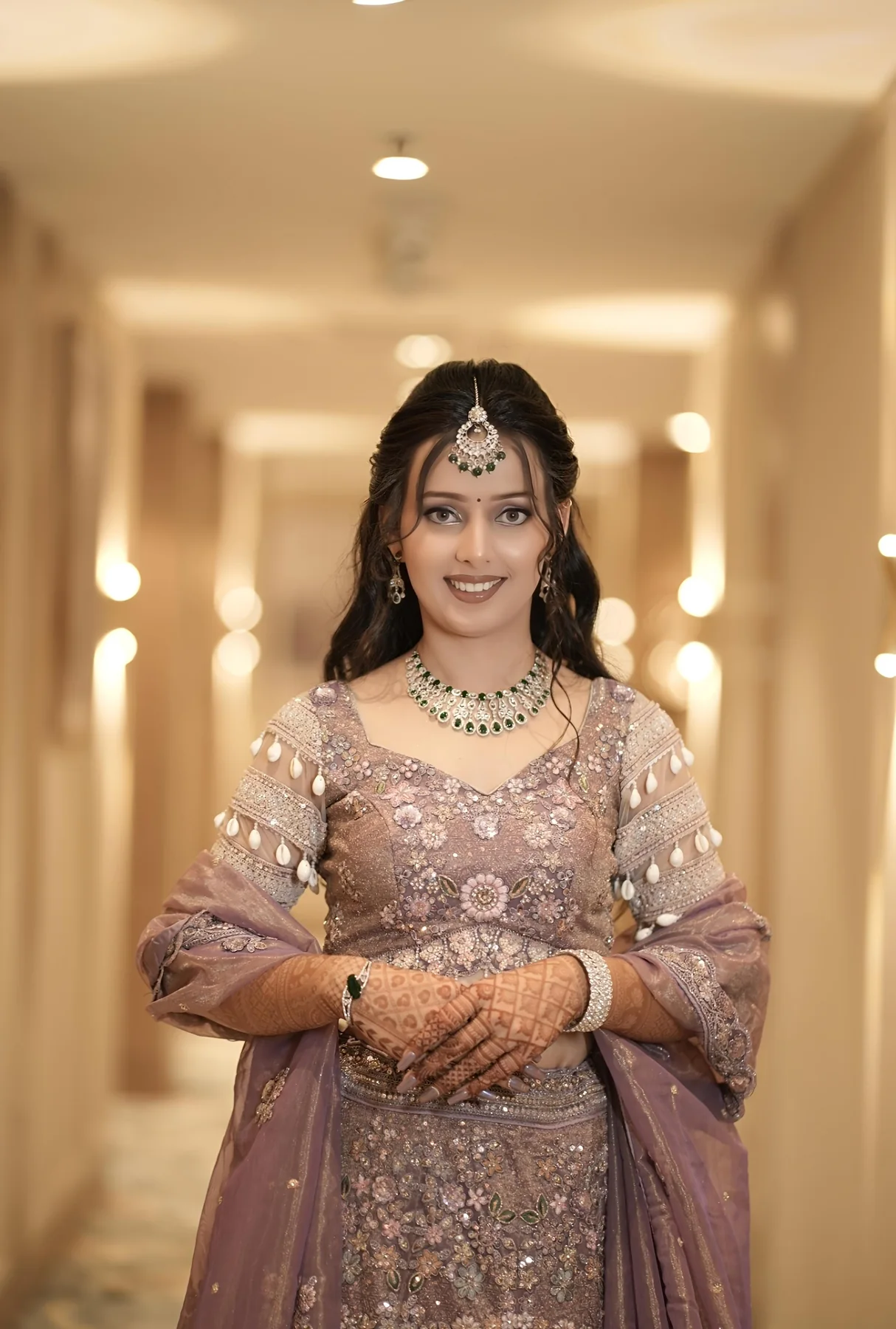 Soft bridal portrait in mauve lehenga with jewellery